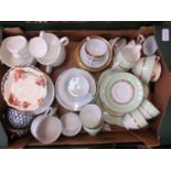 A tray containing an assortment of cups and saucers