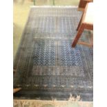 A rectangular turquoise rug