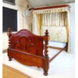 A 19th century and later mahogany half tester bed, the canopy upholstered in a floral striped fabric