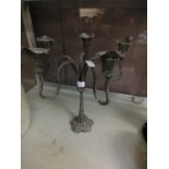 A white metal five branch candelabra having makers name to base