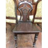 A Victorian style shield back hall chairs