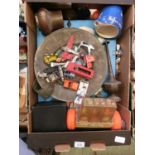 A tray containing die cast toys, plates, games, etc