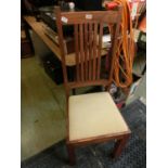 An Indonesian hard wood high back dining chair with drop in seat