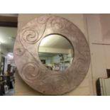 A modern circular framed mirror