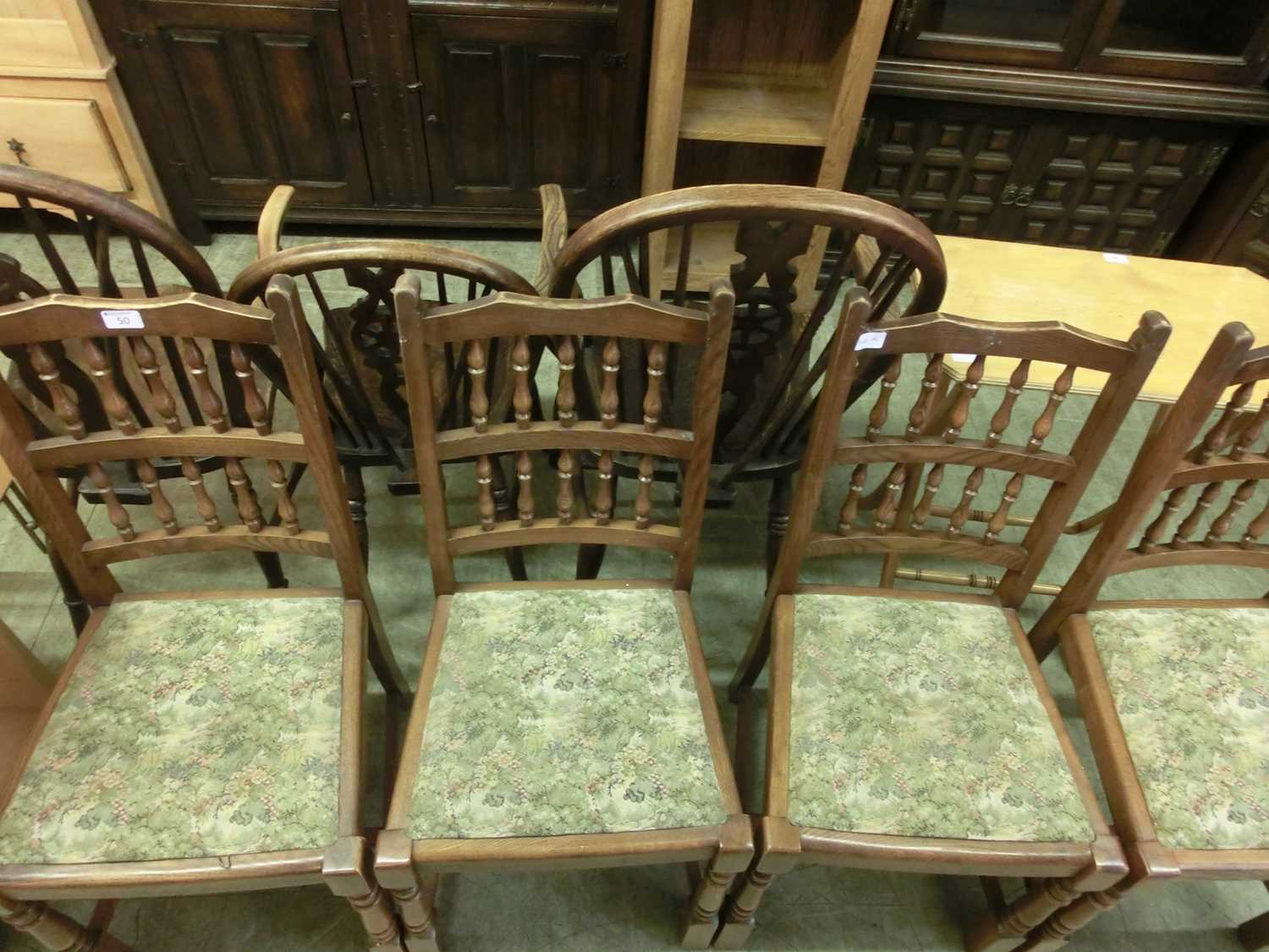 A set of four spindle back dining chairs