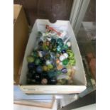 A box containing a quantity of marbles