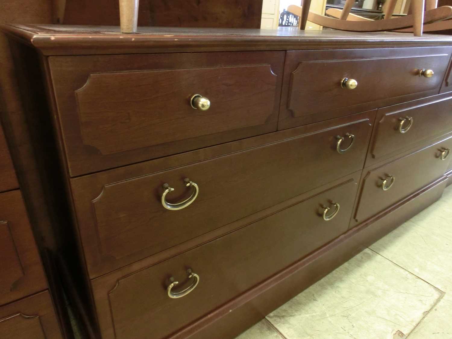 A modern G-Plan bank of three drawers above two long drawers