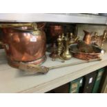 A large selection of brass and copperware to include coal box, meat jack, candlestick, etc