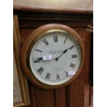 A reproduction oak cased circular wall clock by Knight and Gibbins of London