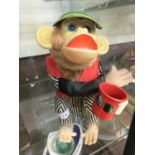 A mid-20th century battery operated monkey