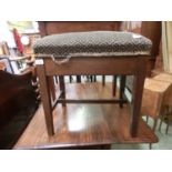 An early 20th century mahogany framed overstuffed seated music stool