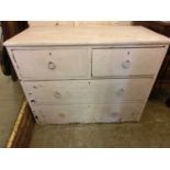 A white painted chest of two short over two long drawers