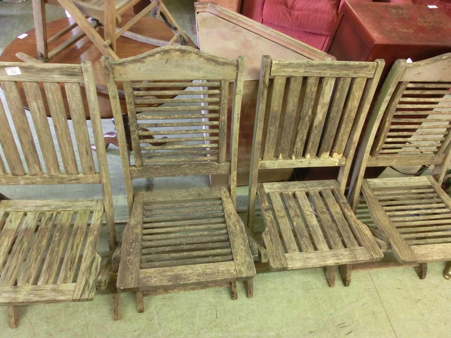 Two pairs of weathered teak garden folding chairs