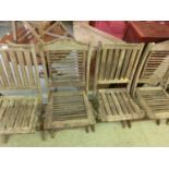 Two pairs of weathered teak garden folding chairs