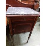 An inlaid pot cupboard with a grey marble top supported on circular tapering legs