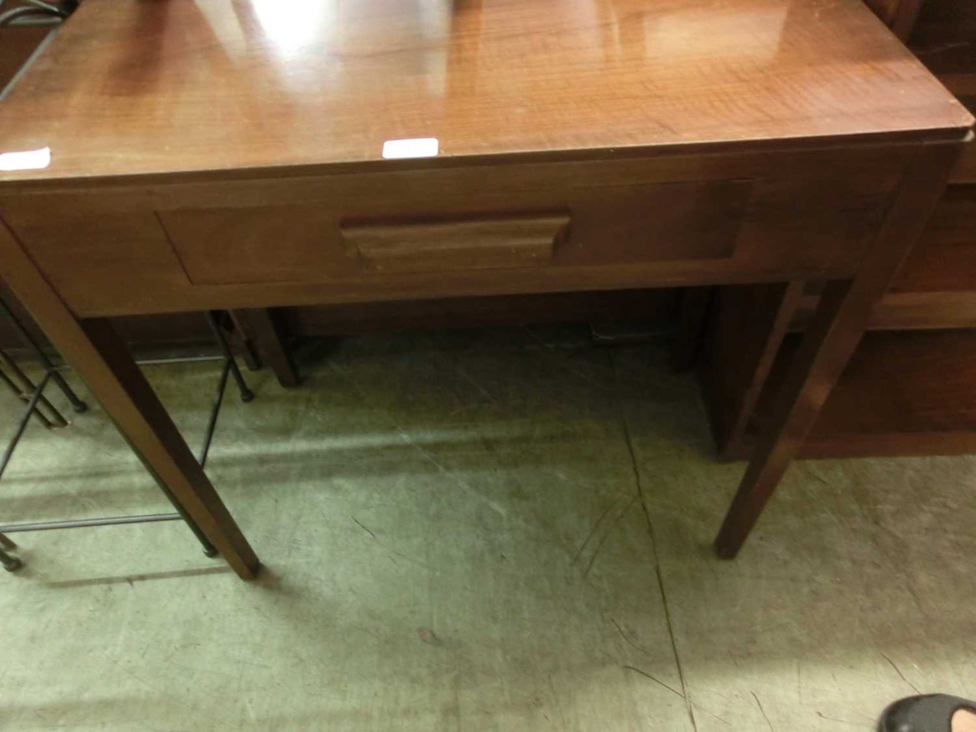 A mid-20th century walnut veneered side table with single drawer