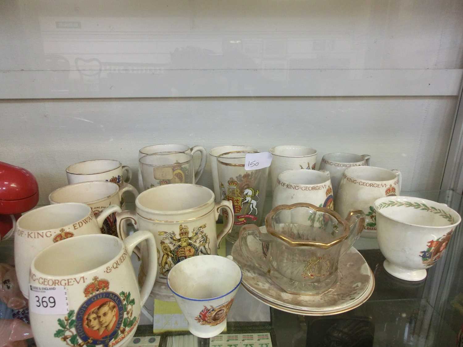 A selection of Coronation mugs and glasses celebrating Queen Elizabeth II, George VI etc