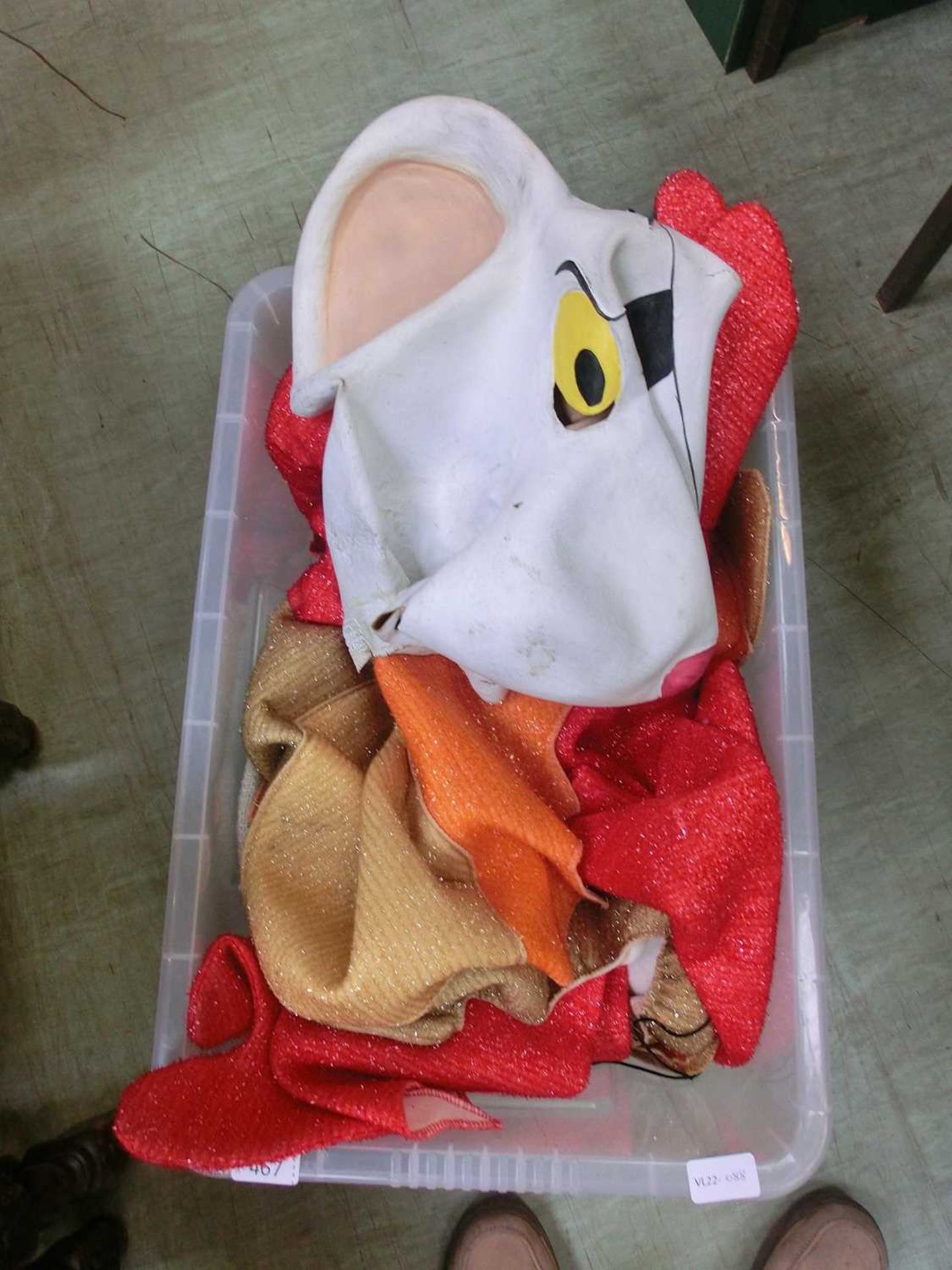 A box containing Dangermouse mask and other fancy dress items