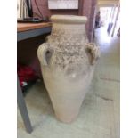 A terracotta Grecian style amphora