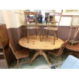 A set of four reproduction rail back dining chairs