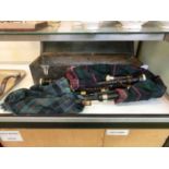 A set of bagpipes in wooden boxCondition and functionality unknown, advise viewing in person.