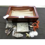 A box containing an assortment of brooches, cigarette case, etc