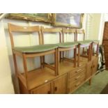 A set of four mid-20th century teak dining chairs