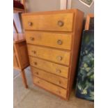 A mid-20th century plywood chest of six drawers