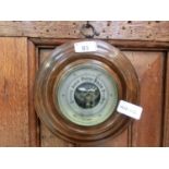 An early 20th century walnut barometer