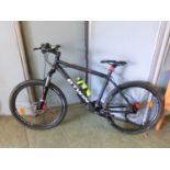 A BTwin Rockrider520 mountain bike with front suspension and disk brakesTyres marked 26 likely