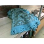 Two turquoise wool rugs