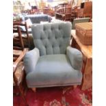 A turquoise draylon upholstered chair