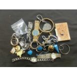 A bag containing a quantity of watches, yellow metal jewellery, etc