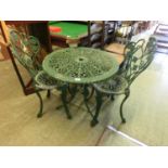 A cast aluminium green painted bistro set, table and two chairs
