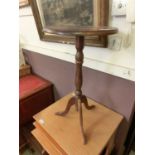 A reproduction circular topped wine table