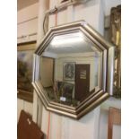 A silver framed octagonal bevel glass mirror