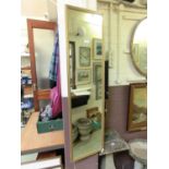 A gilt framed rectangular mirror