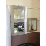 A pair of modern brushed chrome effect mirrors together with a gilt edged mirror