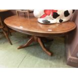 A reproduction possible walnut veneered pedestal occasional table