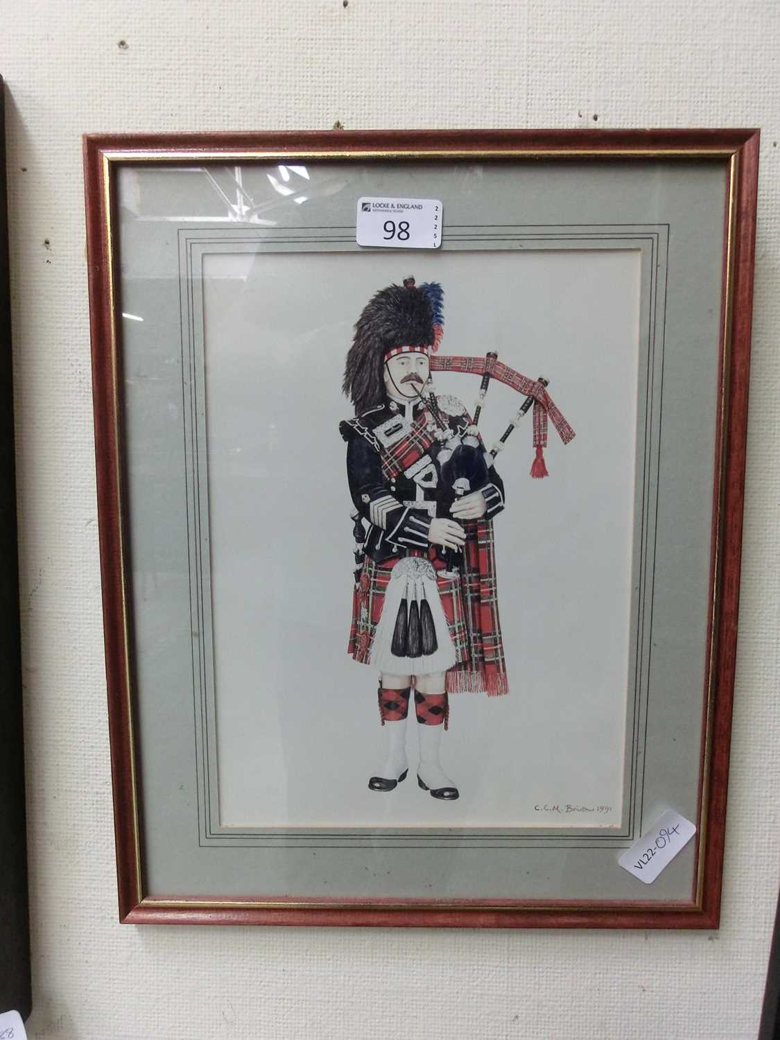 A framed and glazed pen and ink drawing of bagpipe player signed C.C.M.Bristo