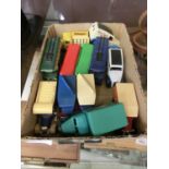 A box containing a quantity of die cast coaches and trucks
