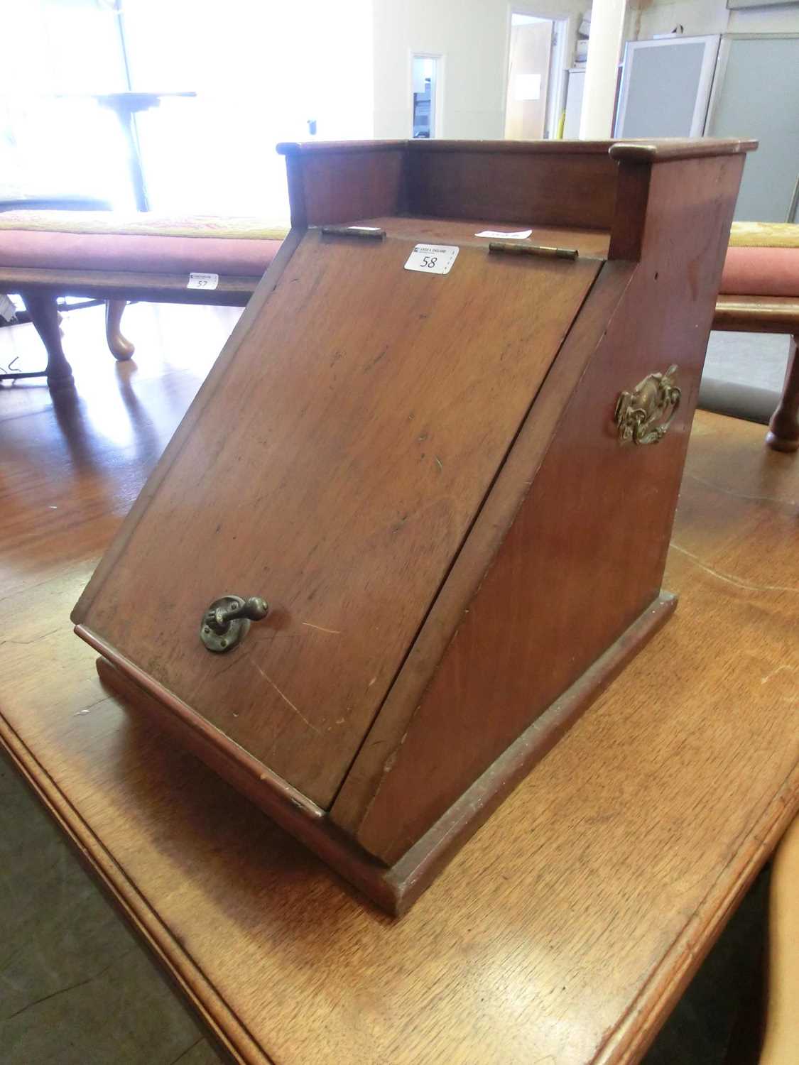 An early 20th century walnut coal box with lift-up lid