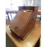 An early 20th century walnut coal box with lift-up lid