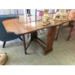 A mid-20th century walnut veneered drop-leaf table