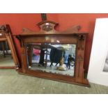 A walnut framed early 20th century over mantle mirror