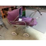 A child's dolls pram by Swallow