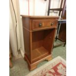 A modern yew effect hall cabinet having single drawer above open storage