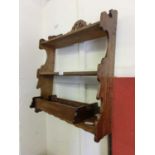 A wall mounted oak shelf unit together with one other