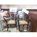 A pair of open arm dolls house chairs