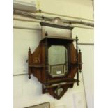 An Edwardian rosewood and marquetry set of wall shelves with bevelled plate to back